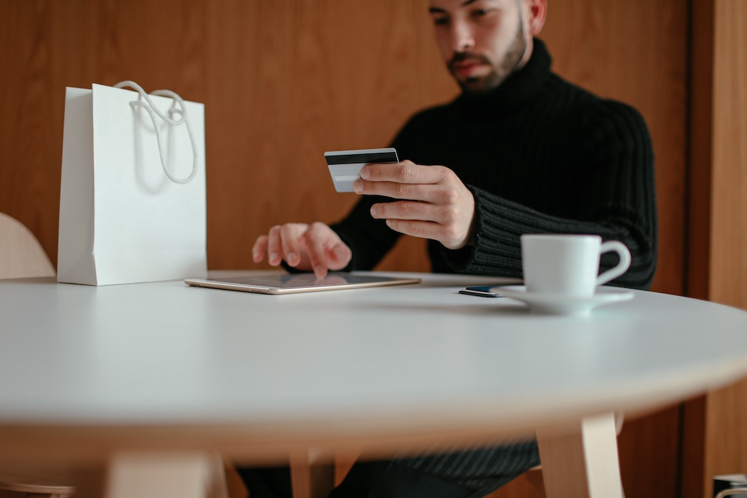Man with tablet and credit card - Photo by Cup of Couple from Pexels