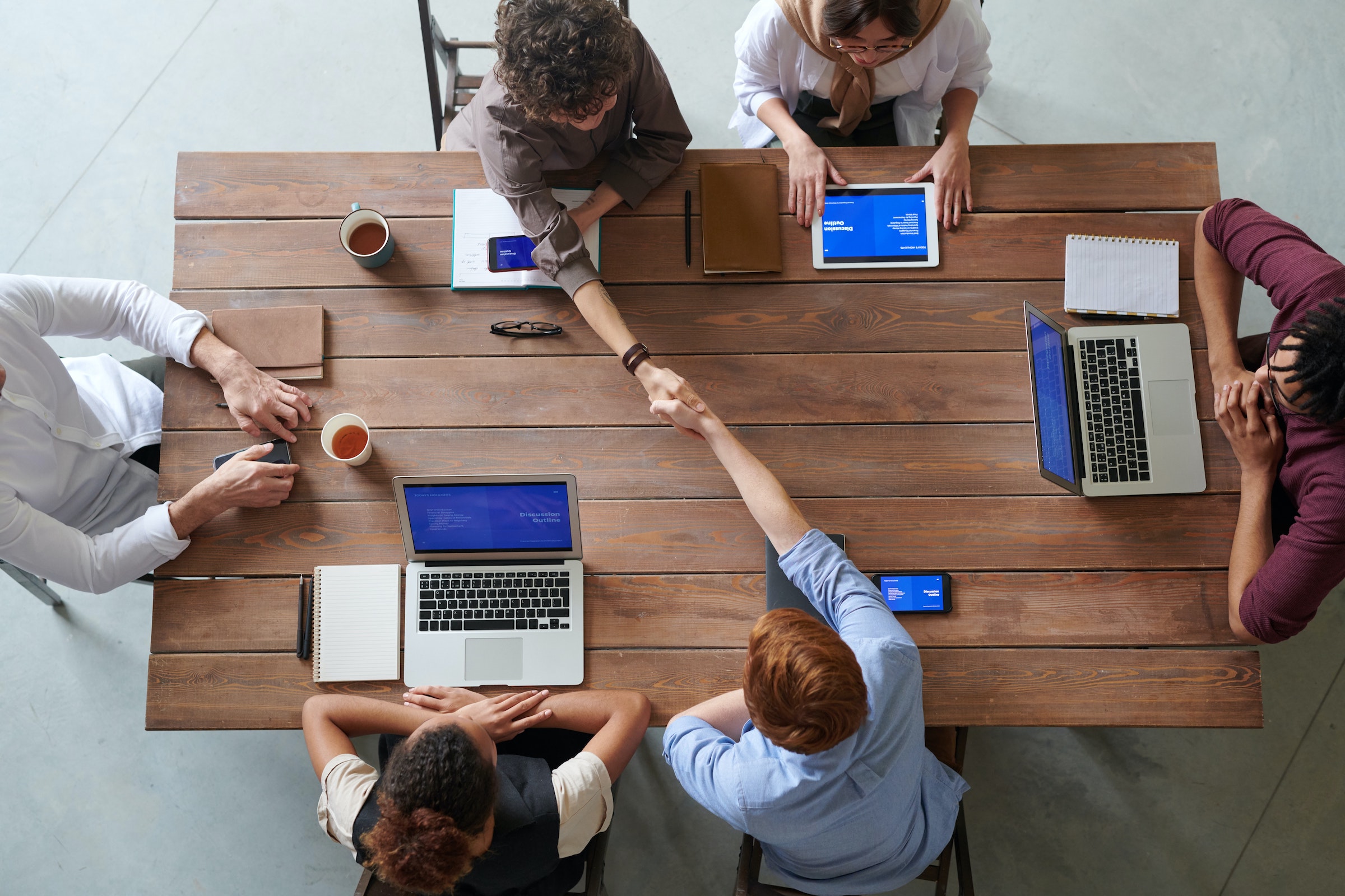 Reputation, deliverability: team working around a table