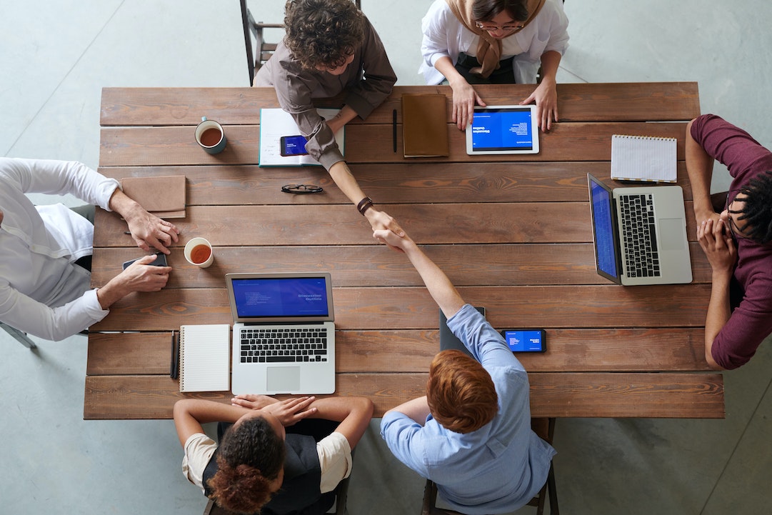 Reputation, deliverability: team working around a table