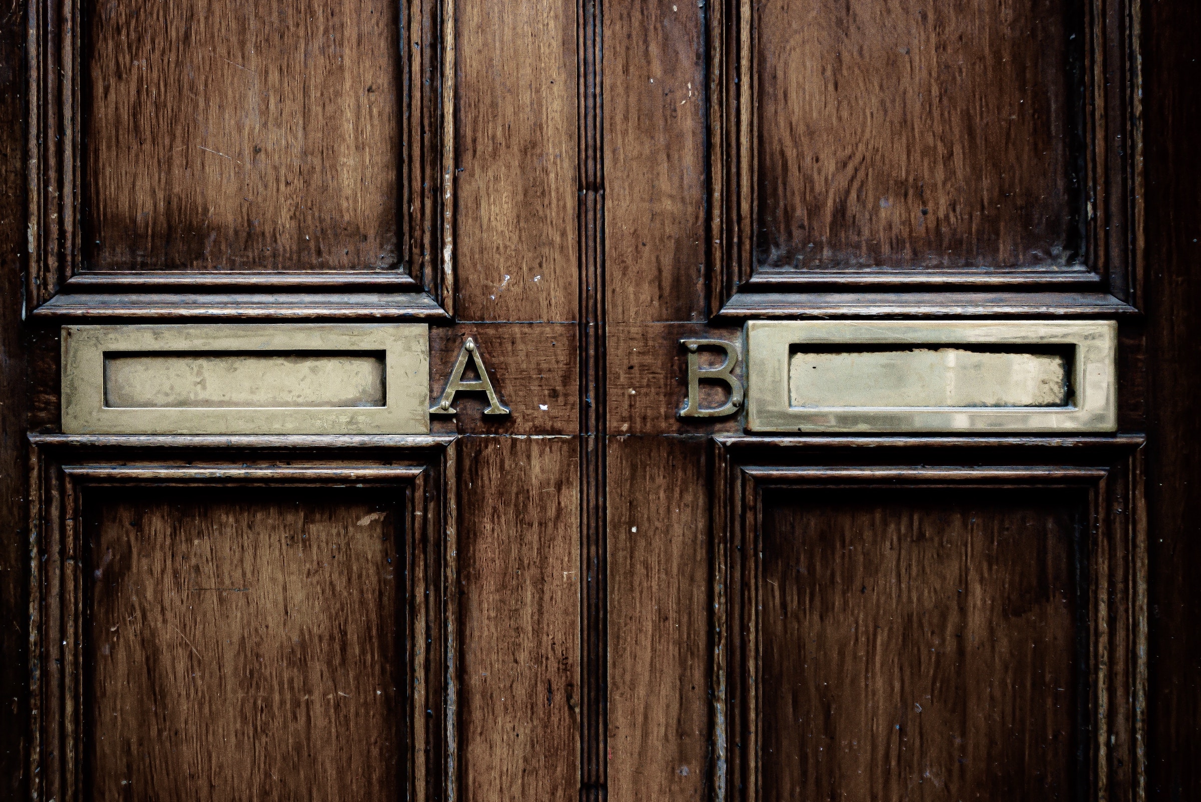 Mailbox A and mailbox B side to side - Photo by Jason Dent on Unsplash