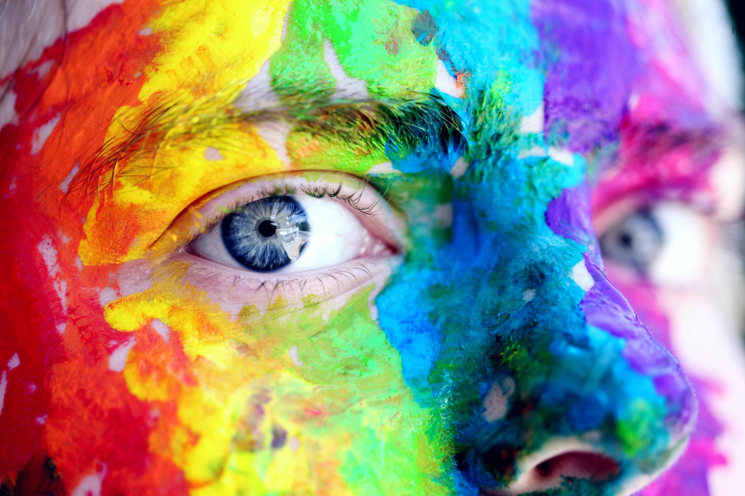 Face painted with colors - Photo by Alexander Grey - Pexels