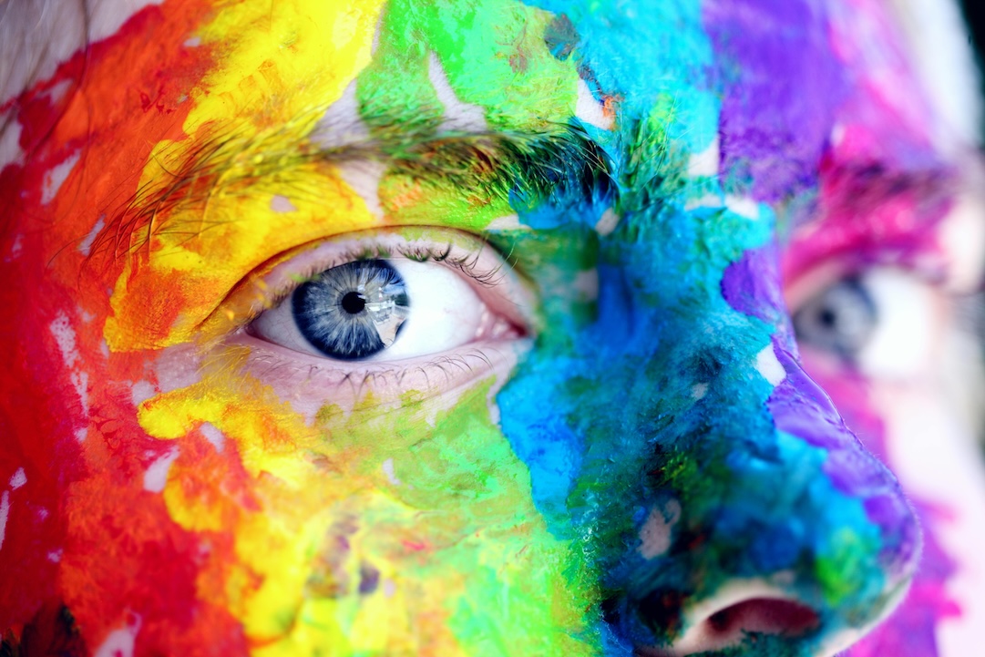 Face painted with colors - Photo by Alexander Grey - Pexels